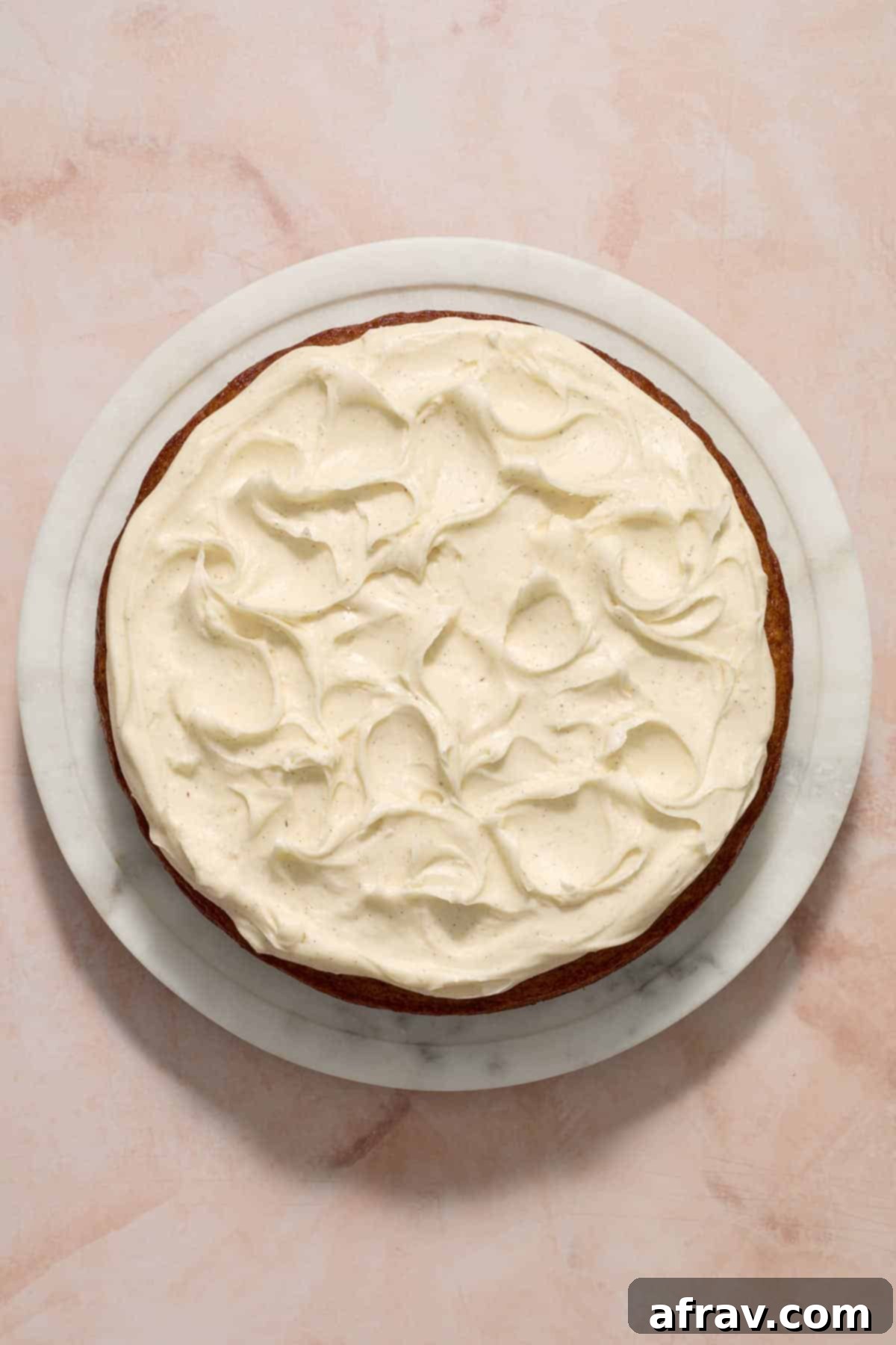 Frosting spread out on top of the cake.