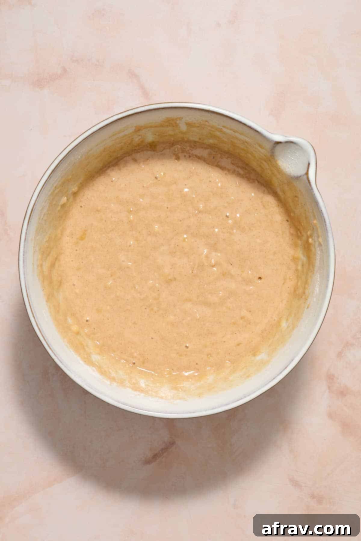 Batter mixed together in a white bowl.
