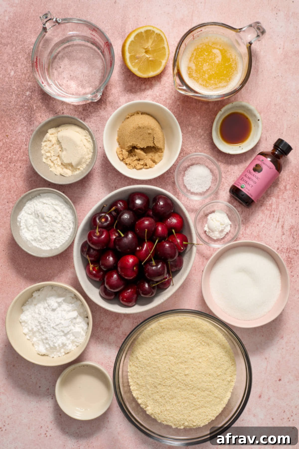 Individual bowls of ingredients neatly arranged to make cherry pie bars.