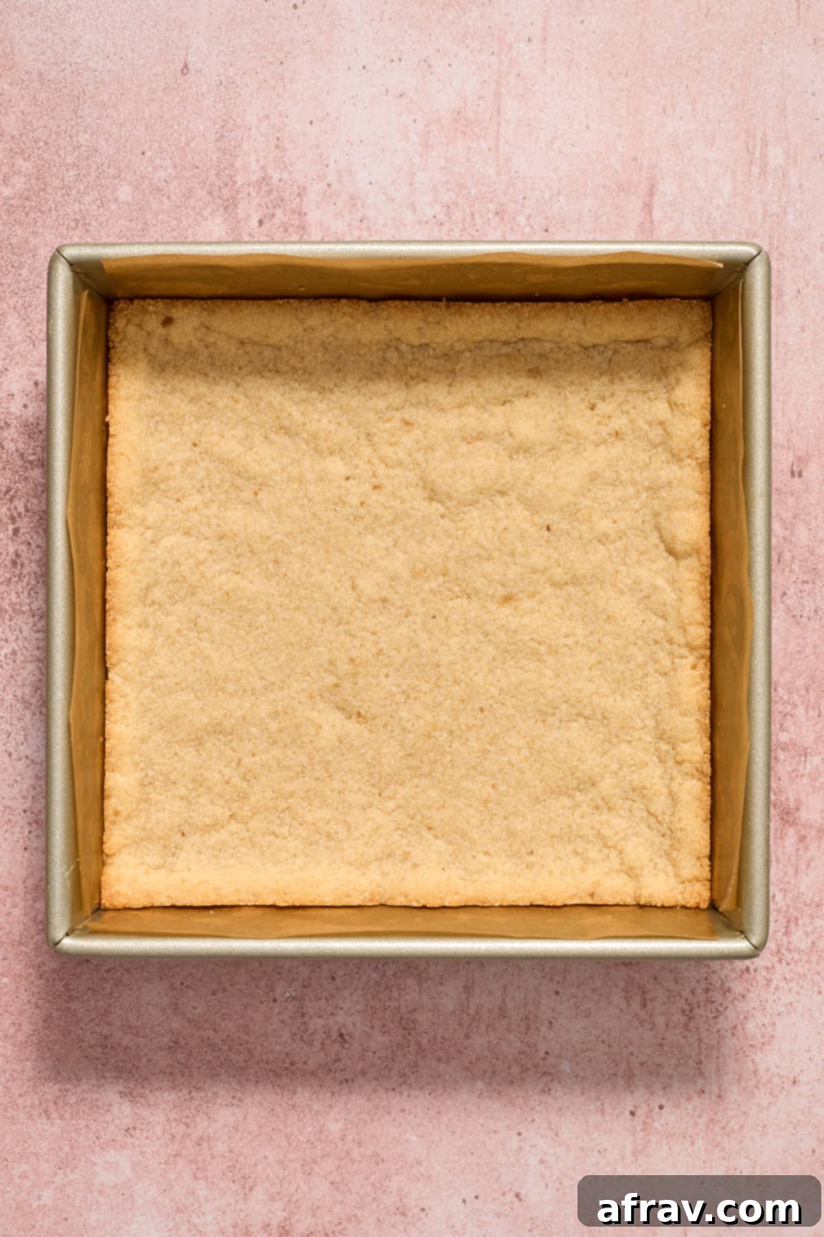 Baked crust in the pan, showing golden-brown edges.