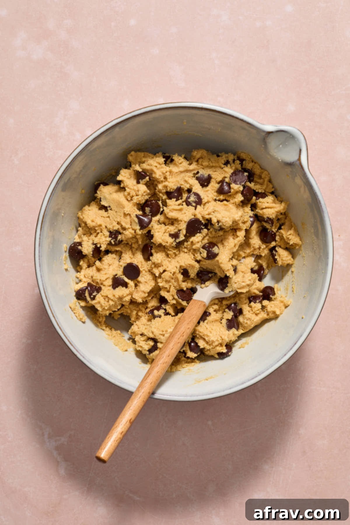 Chocolate chips folded into the batter with a spatula.