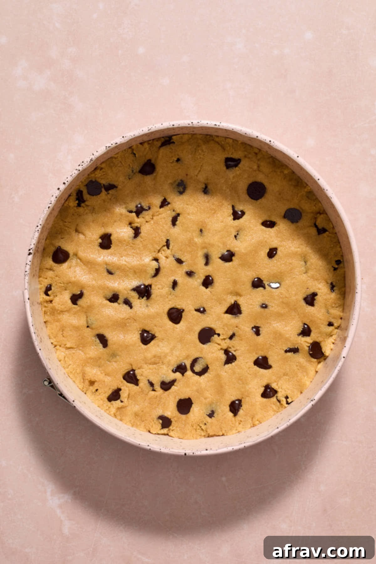 Cookie dough pressed into a springform pan.
