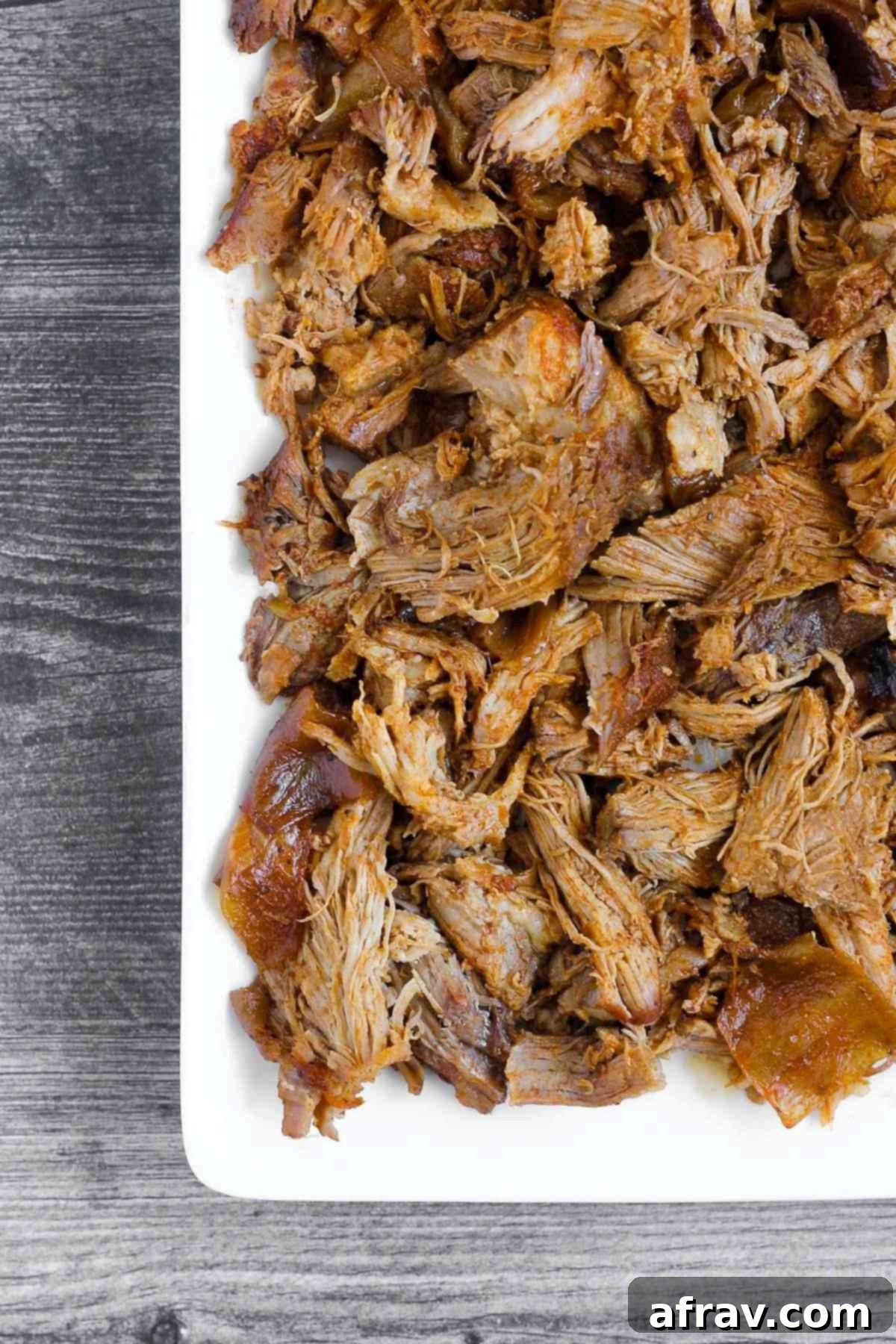 Close-up of pulled pork on a serving tray.