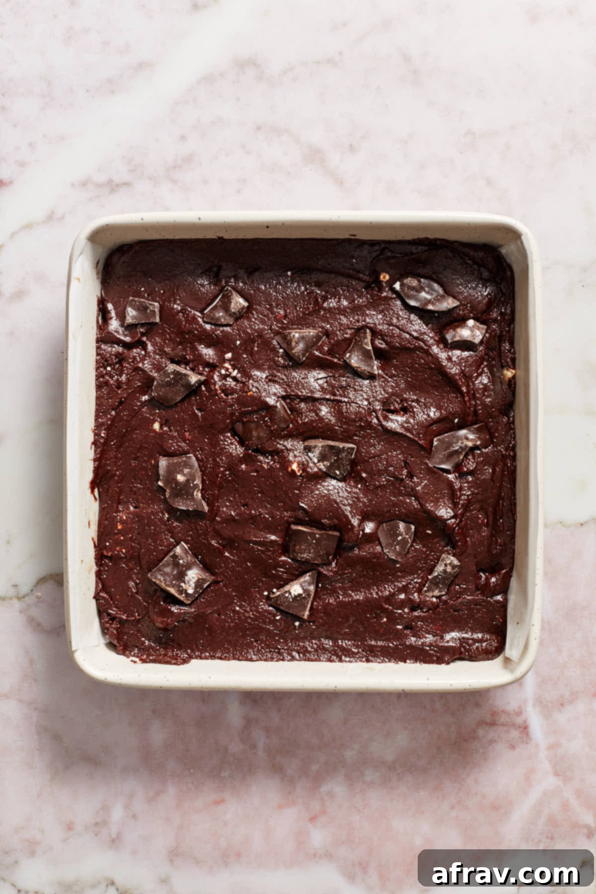 Minty Mocha Magic Brownies 8 Brownie batter spread out in prepared pan with peppermint bark pressed into the top.