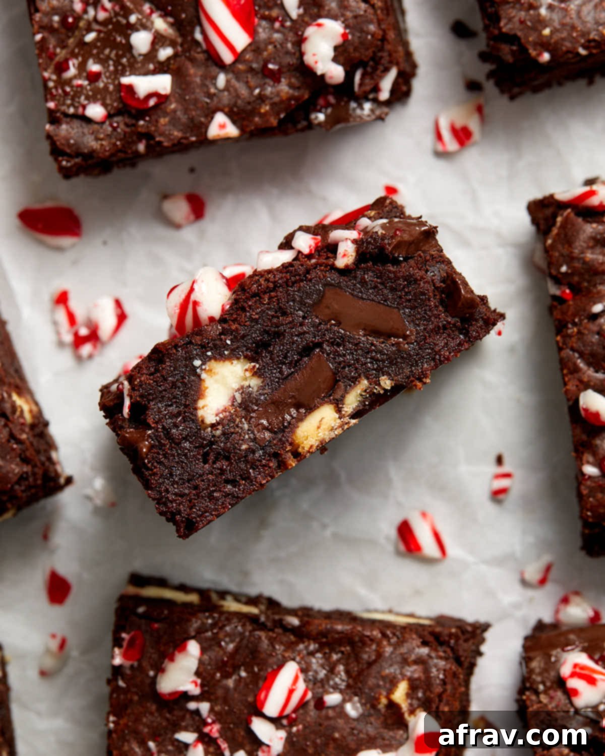 Minty Mocha Magic Brownies 10 Brownie turned on its side to show the chunks of peppermint bark inside.