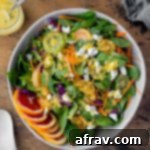 Overhead view of a large bowl of Winter Salad with Citrus Honey Dressing.