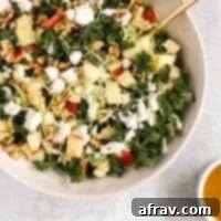 Delicious Kale and Brussels Sprouts Salad in a white bowl.