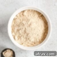 Coconut powdered sugar in a small white dish.