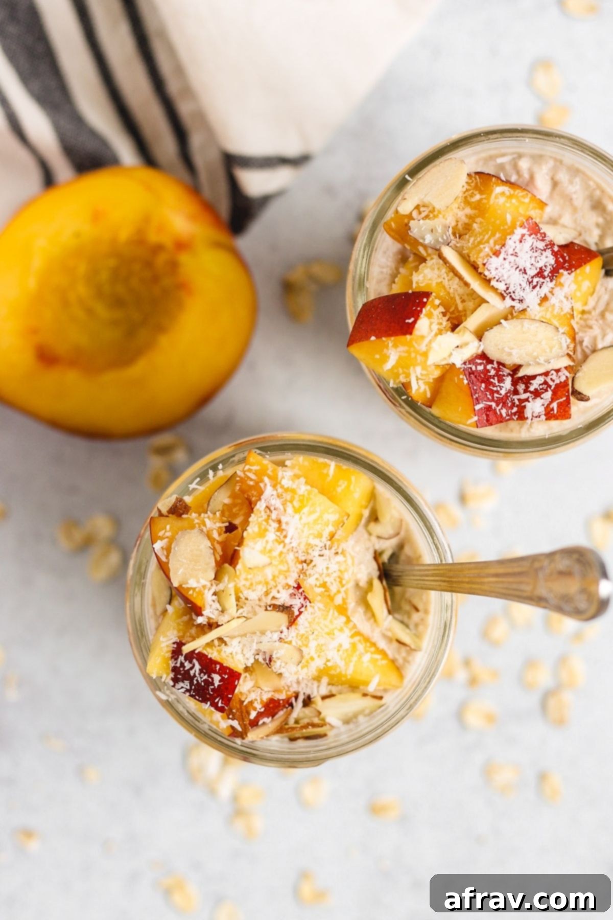 Overhead view of overnight oats in a mason jar topped with peaches.