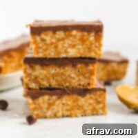Healthier scotcheroo bars stacked 3 high.
