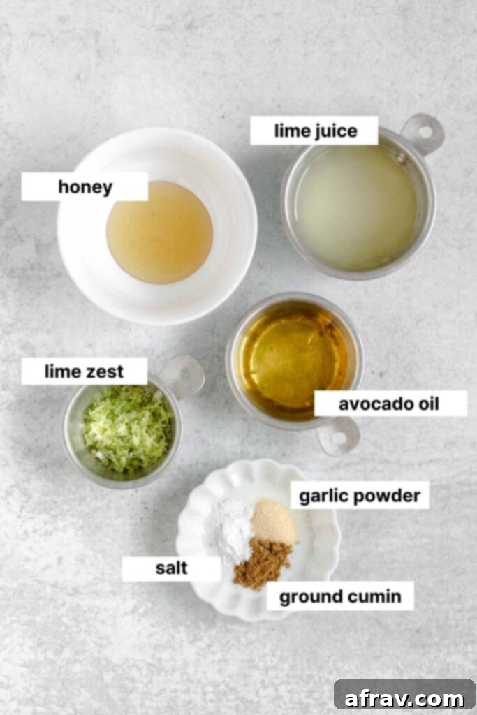 Gallery image of labeled ingredients for both quinoa salad and the lime vinaigrette, highlighting fresh limes, avocado oil, and spices.