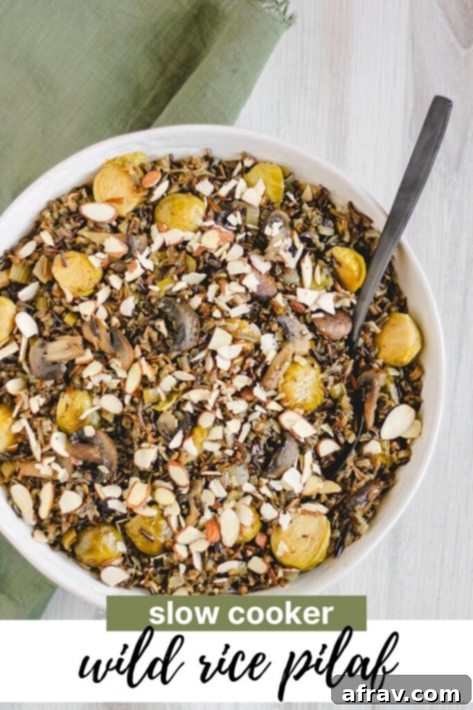 Slow-Cooked Wild Rice Delight 9 Pinterest pin for a healthy slow cooker wild rice pilaf recipe with vegetables