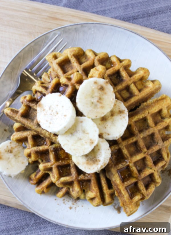 waffles topped with sliced bananas and sprinkled with cinnamon