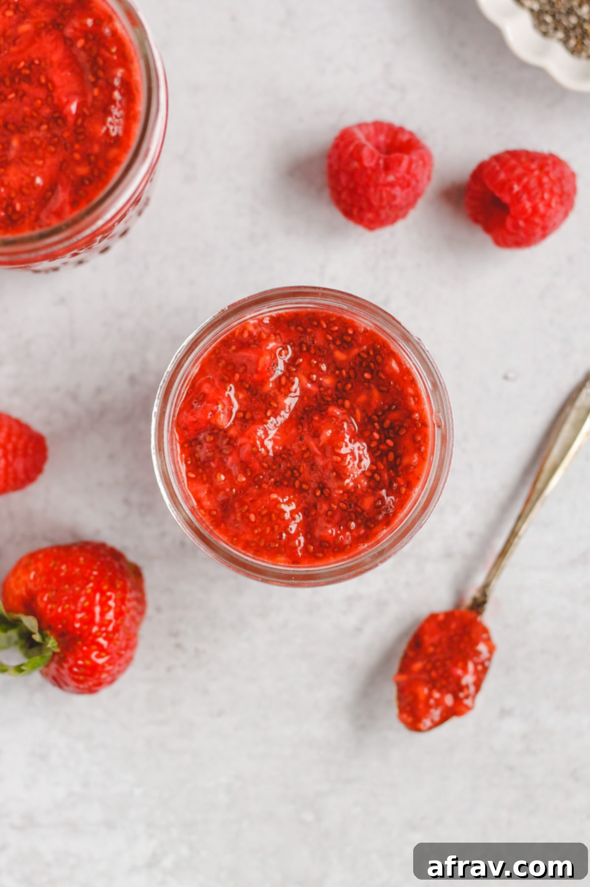 berry chia jam in an open mason jar