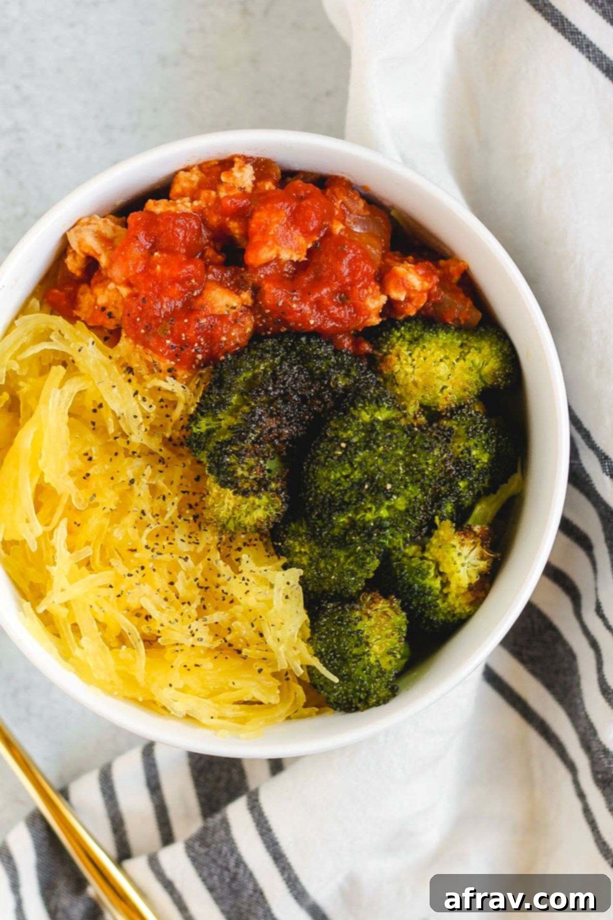 Spaghetti Squash Boats 2 Small bowl filled with spaghetti squash, roasted broccoli, and ground turkey with marinara.