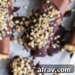 Overhead view of Chocolate Peanut Butter Mocha Nice Cream Pops on parchment paper.