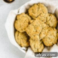 Fluffy Paleo Almond Flour Biscuits 10 Almond flour drop biscuits in a round linen towel lined bread basket, ready to be served.
