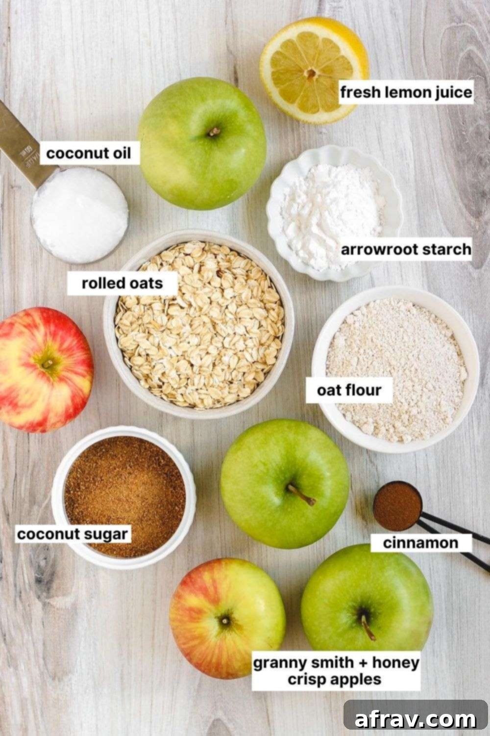 Wholesome Gluten-Free Apple Crisp Made Easy 3 A collection of labeled ingredients including apples, oats, coconut oil, and spices, laid out for making apple crisp.