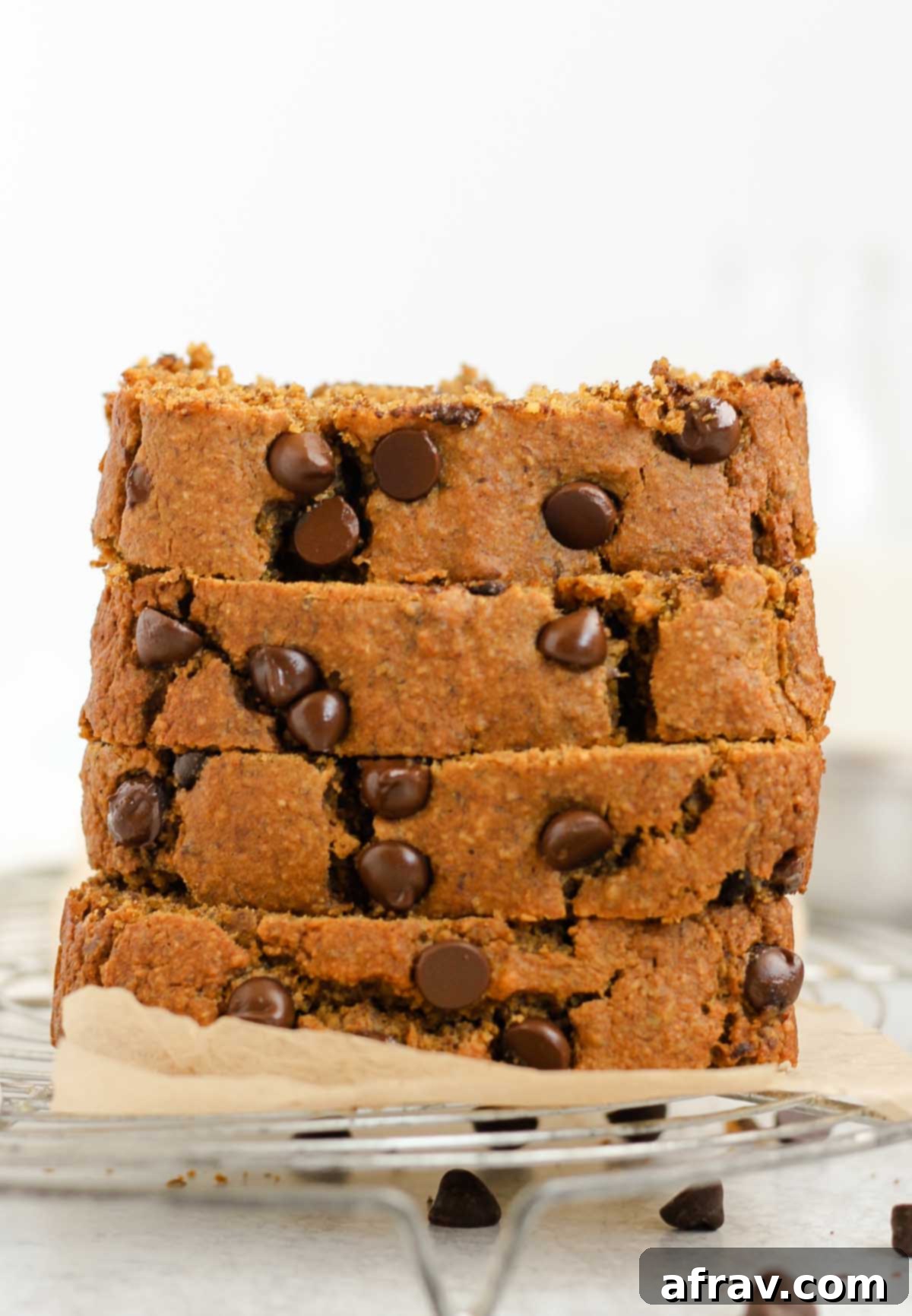 Irresistible Gluten Free Chocolate Chip Pumpkin Bread 2 Four pieces of pumpkin chocolate chip bread stacked.
