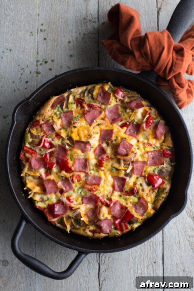 Savoury Sweet Potato Breakfast Skillet with eggs and turkey bacon.