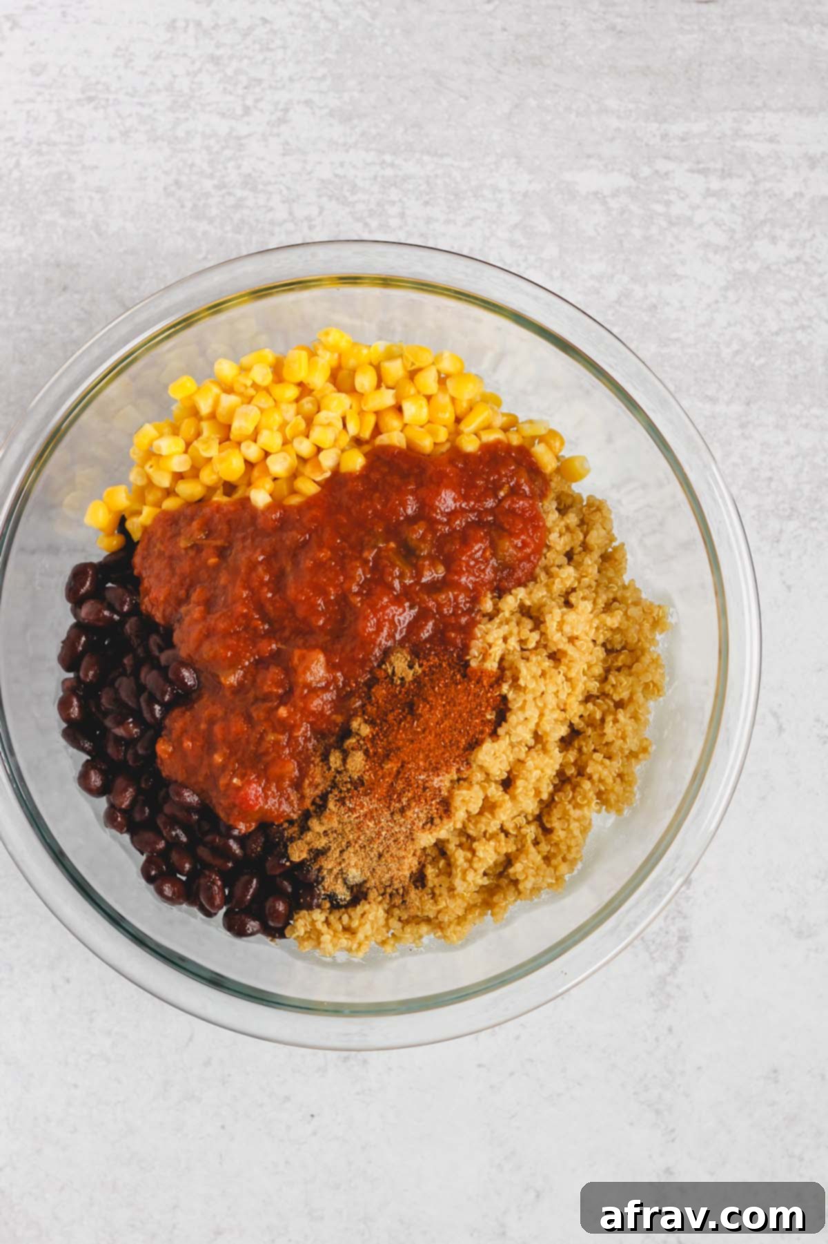 ingredients for stuffed peppers in a glass mixing bowl