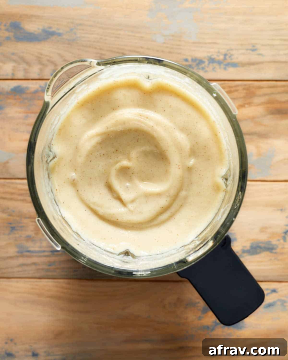 Pureed parsnip pear soup in a blender.