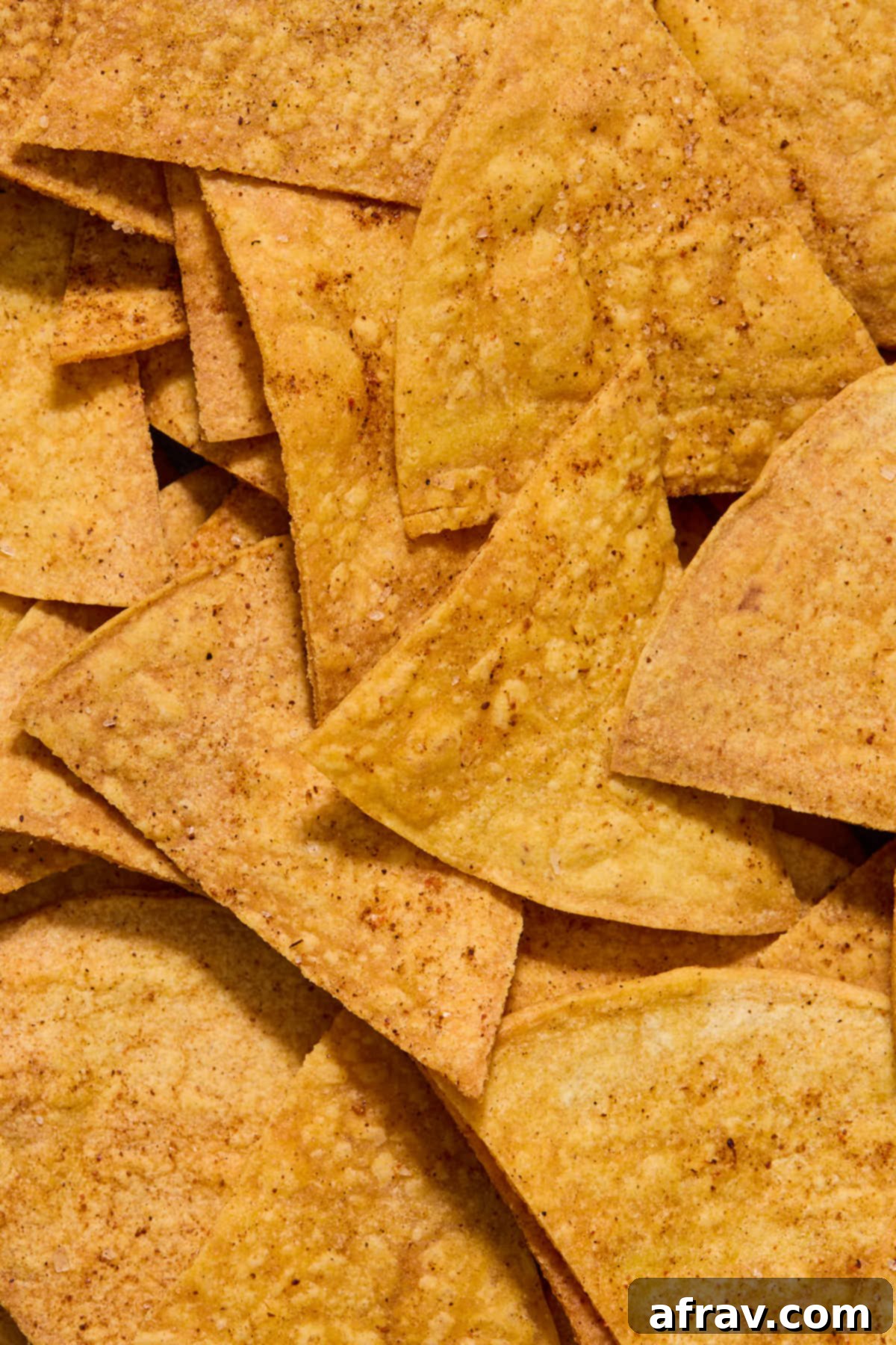 Close up view of air fried tortilla chips.