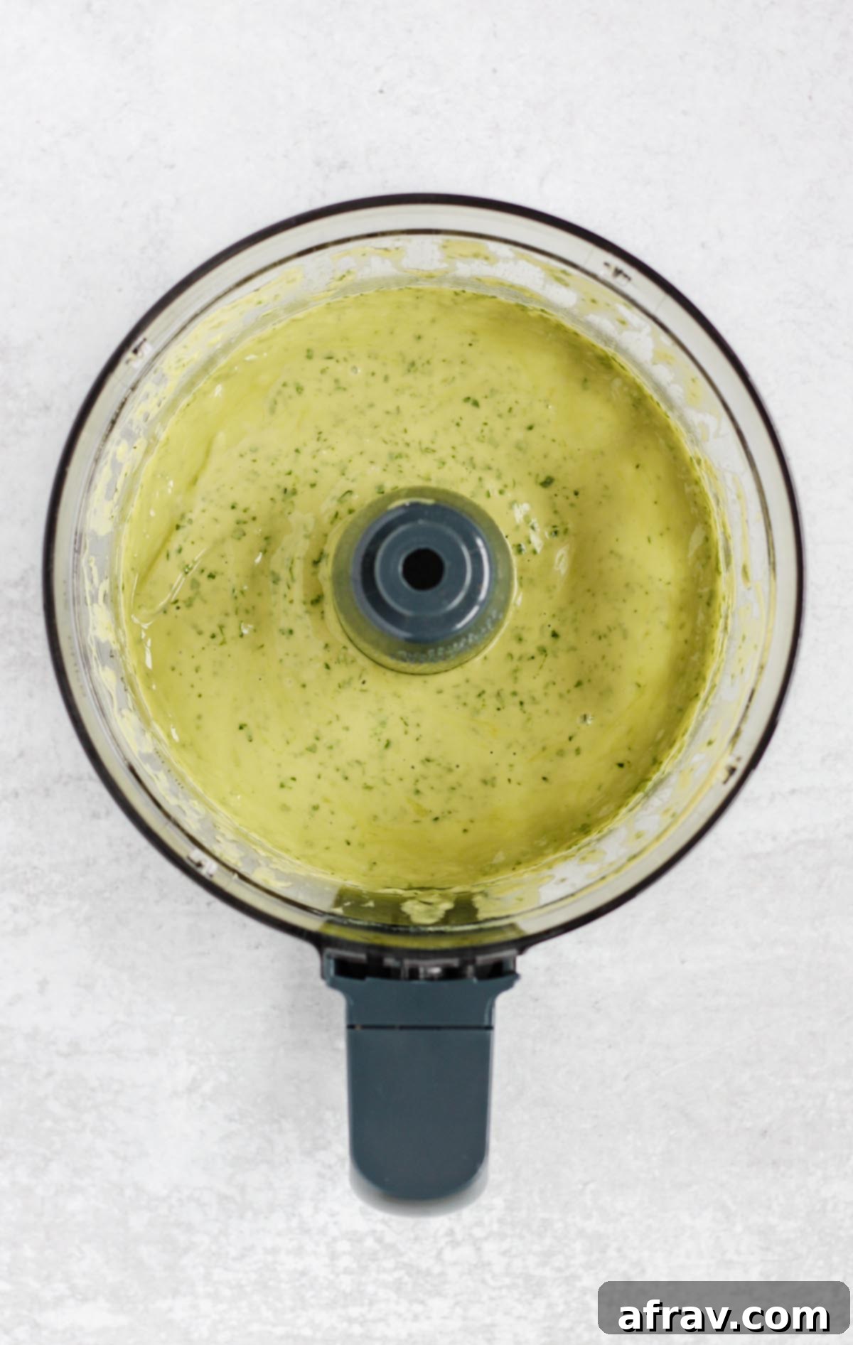 Creamy cilantro lime dressing in a food processor.