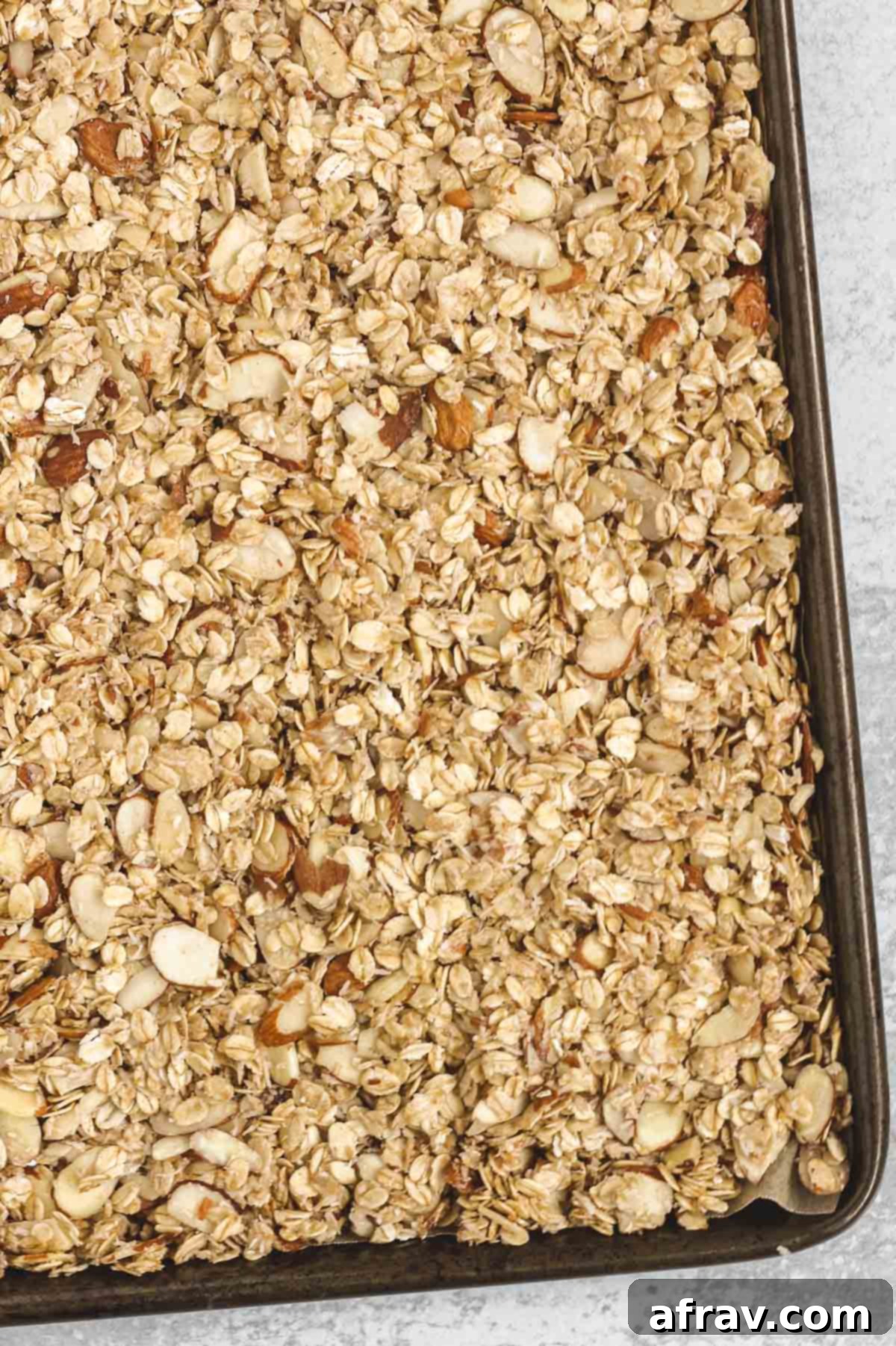 Easy Gluten Free Dairy Free Oat and Honey Granola 7 granola on baking sheet before being baked