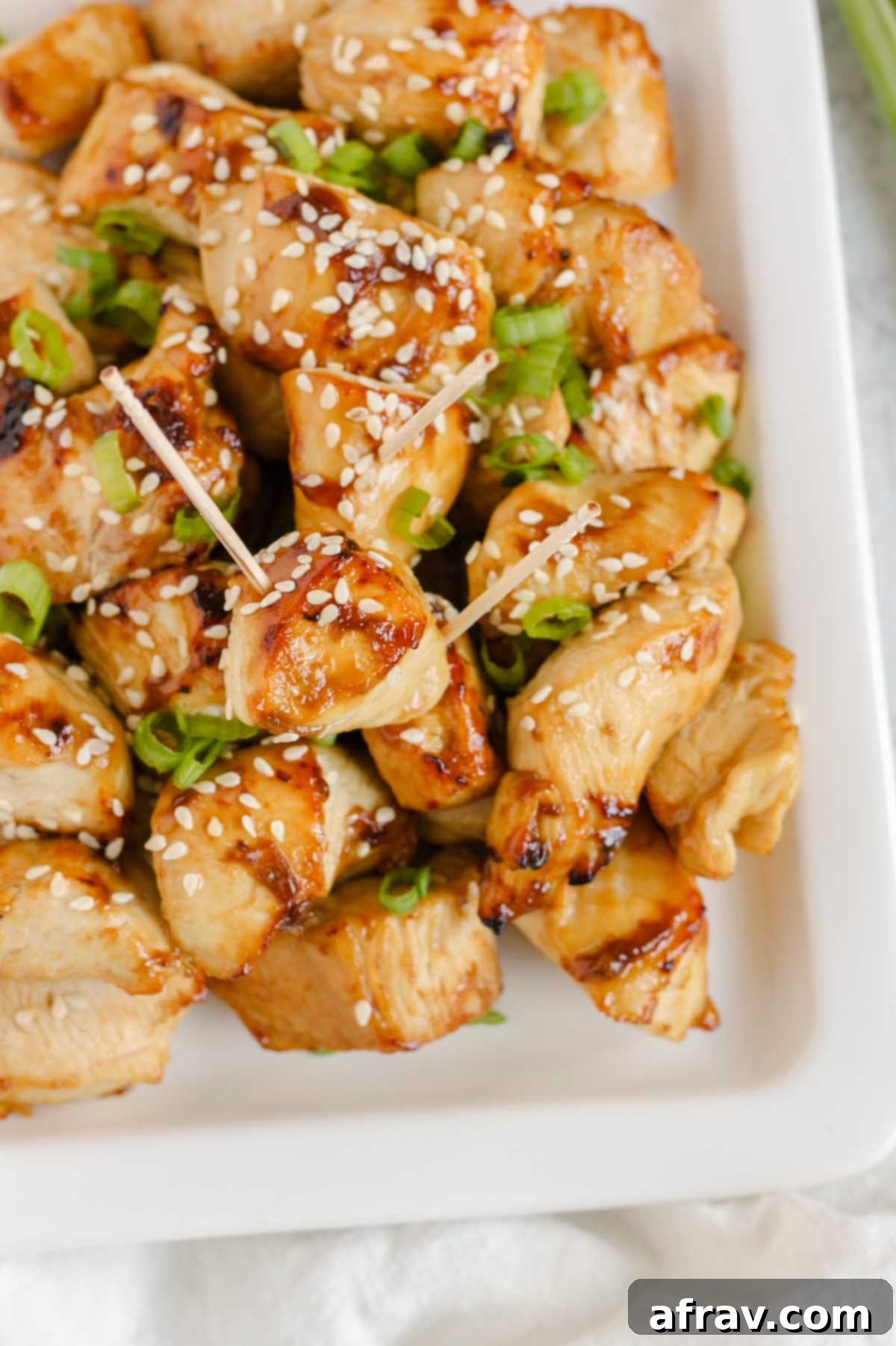 Close up of air fried teriyaki chicken pieces.