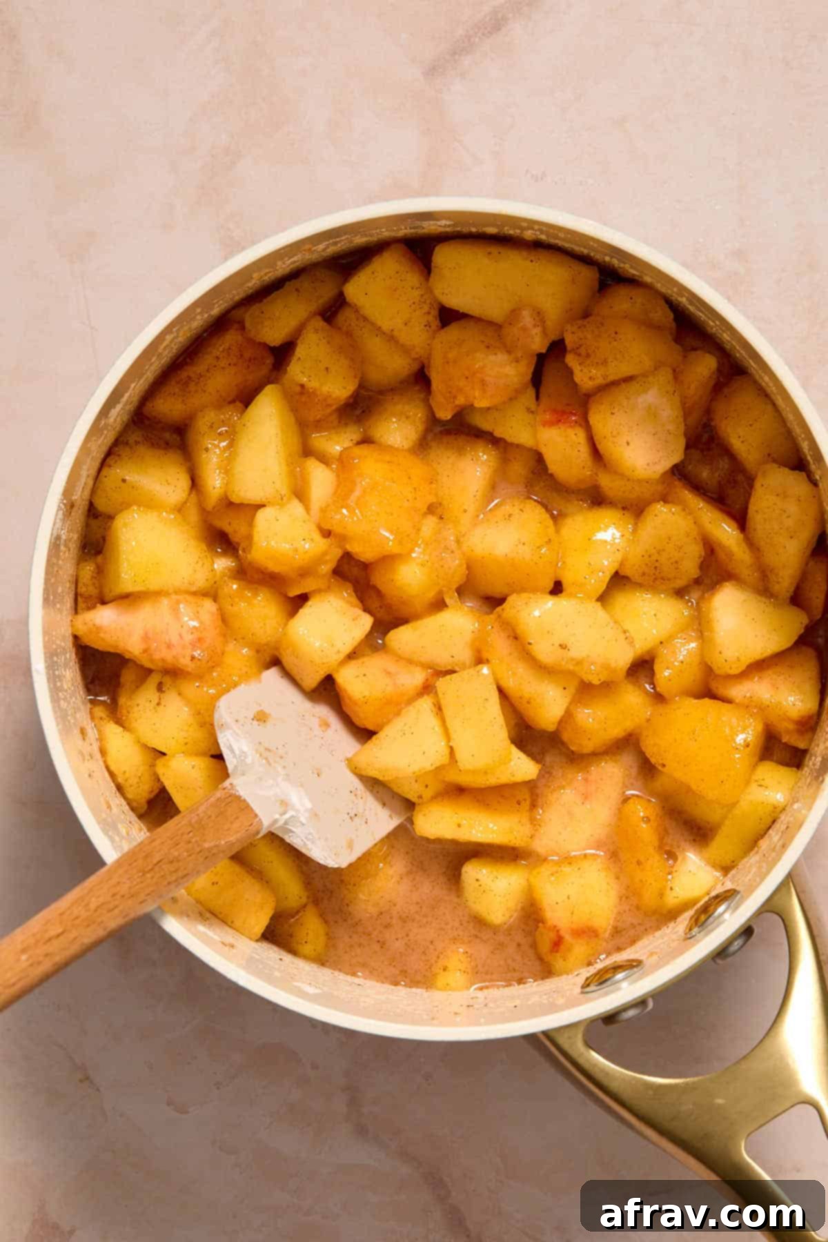 Chopped peaches stirred together with the other filling ingredients in a small saucepan.