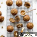 Overhead view of banana nut muffins arranged on a wire rack.