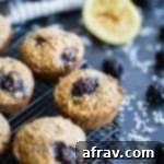 Up-close view of Blackberry Lemon Overnight Oatmeal Muffins cooling on a wire rack.