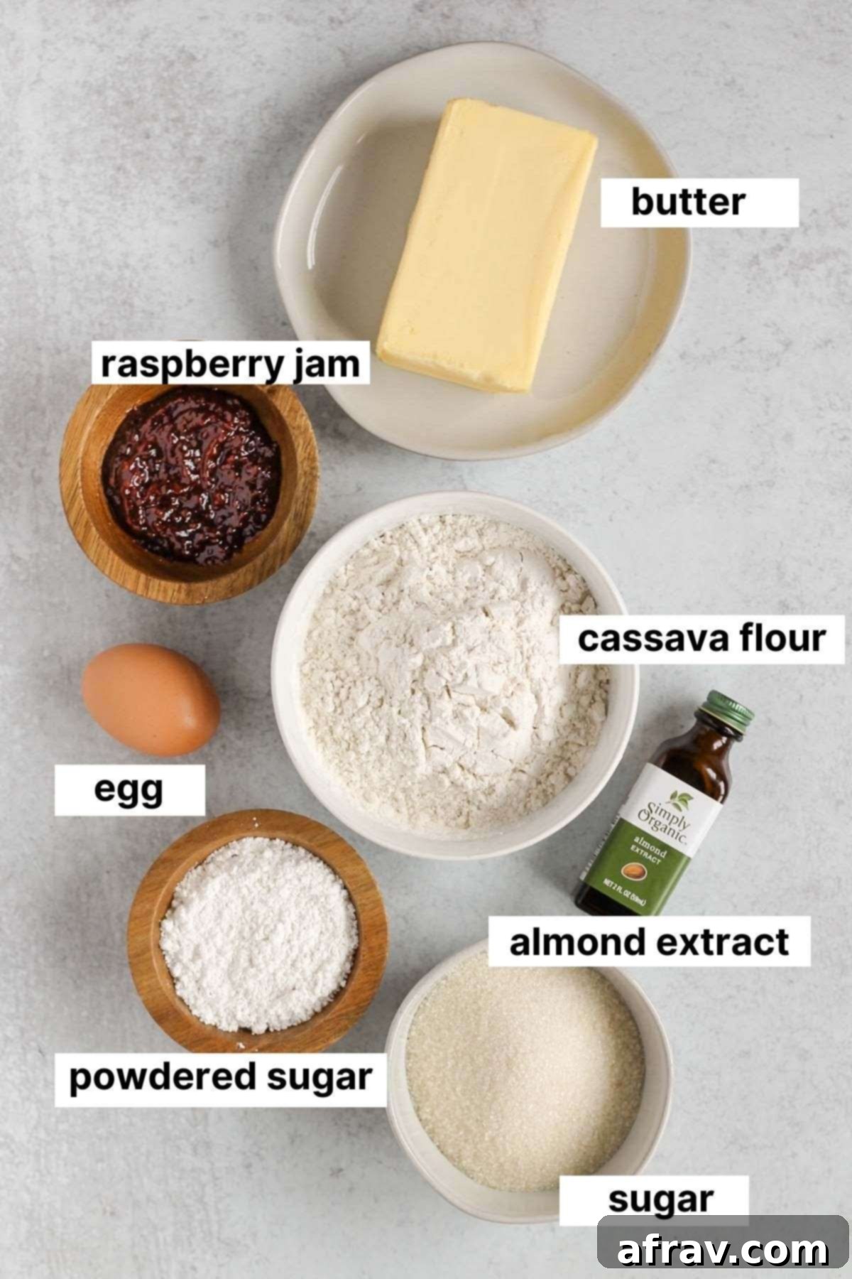 Labeled ingredients used in gluten-free thumbprint cookies, including cassava flour, butter, sugar, and jam.