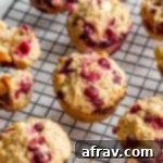 Partridgeberry Muffins cooling on a wire rack.