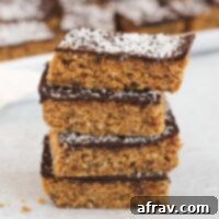 Delicious No-Bake Peanut Butter Oatmeal Bars 10 Peanut butter oat bar squares stacked 4 high.