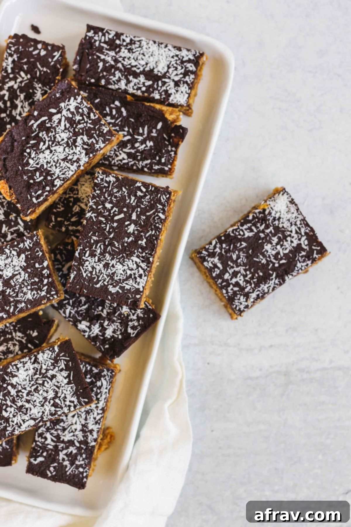 Delicious No-Bake Peanut Butter Oatmeal Bars 9 Peanut butter oatmeal bars on a white serving tray.
