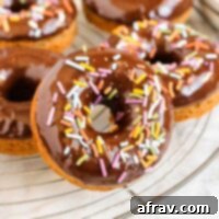 Guilt-Free Paleo Almond Flour Donuts 9 A chocolate-covered Paleo almond flour donut with a hint of sprinkles, ready to be enjoyed.