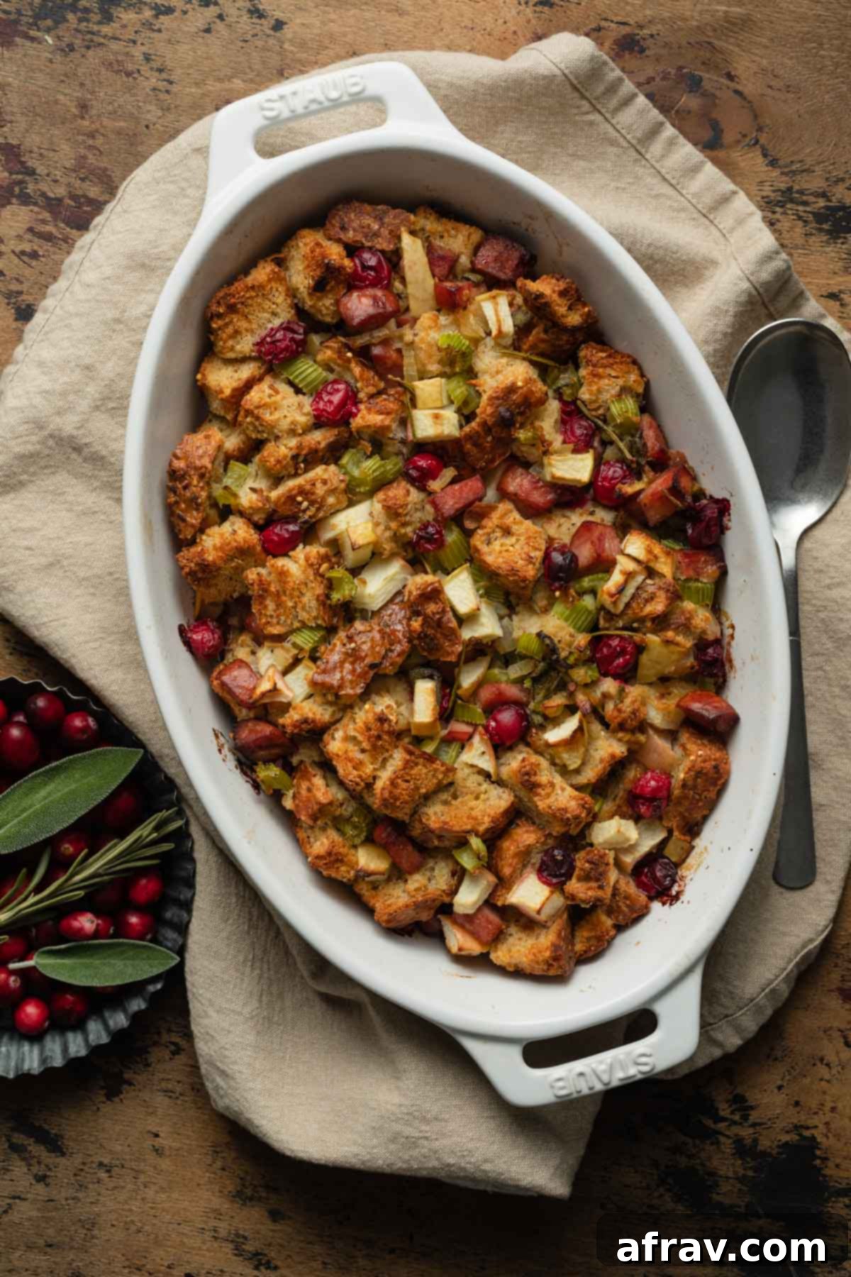 Overhead view of whole wheat stuffing in a baking dish, ready to be served for a festive holiday meal.