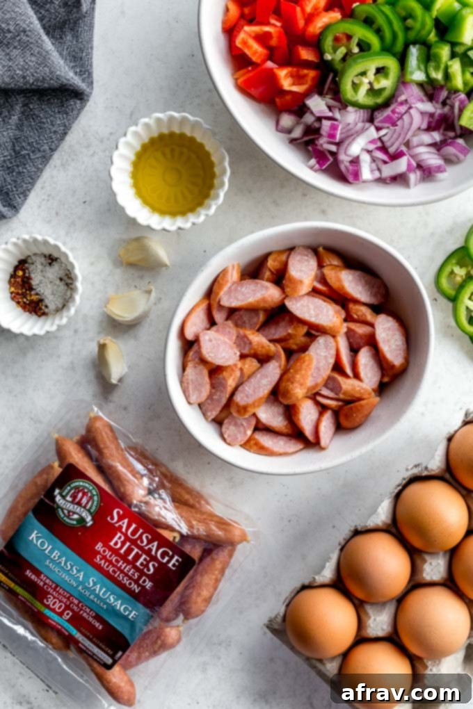 Overhead view of ingredients to make sausage frittata with peppers and onions.