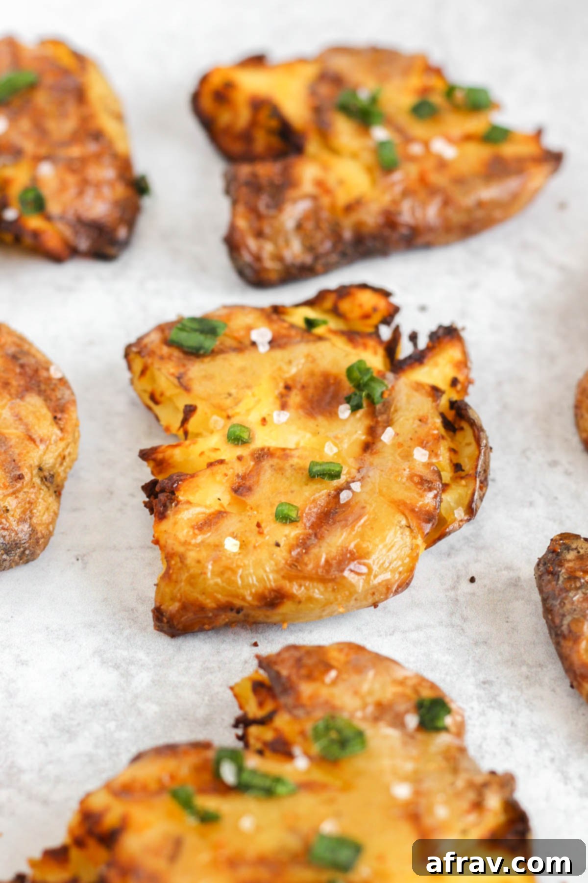 Close up view of smashed potatoes.