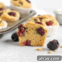 Blackberry muffin cut in half.