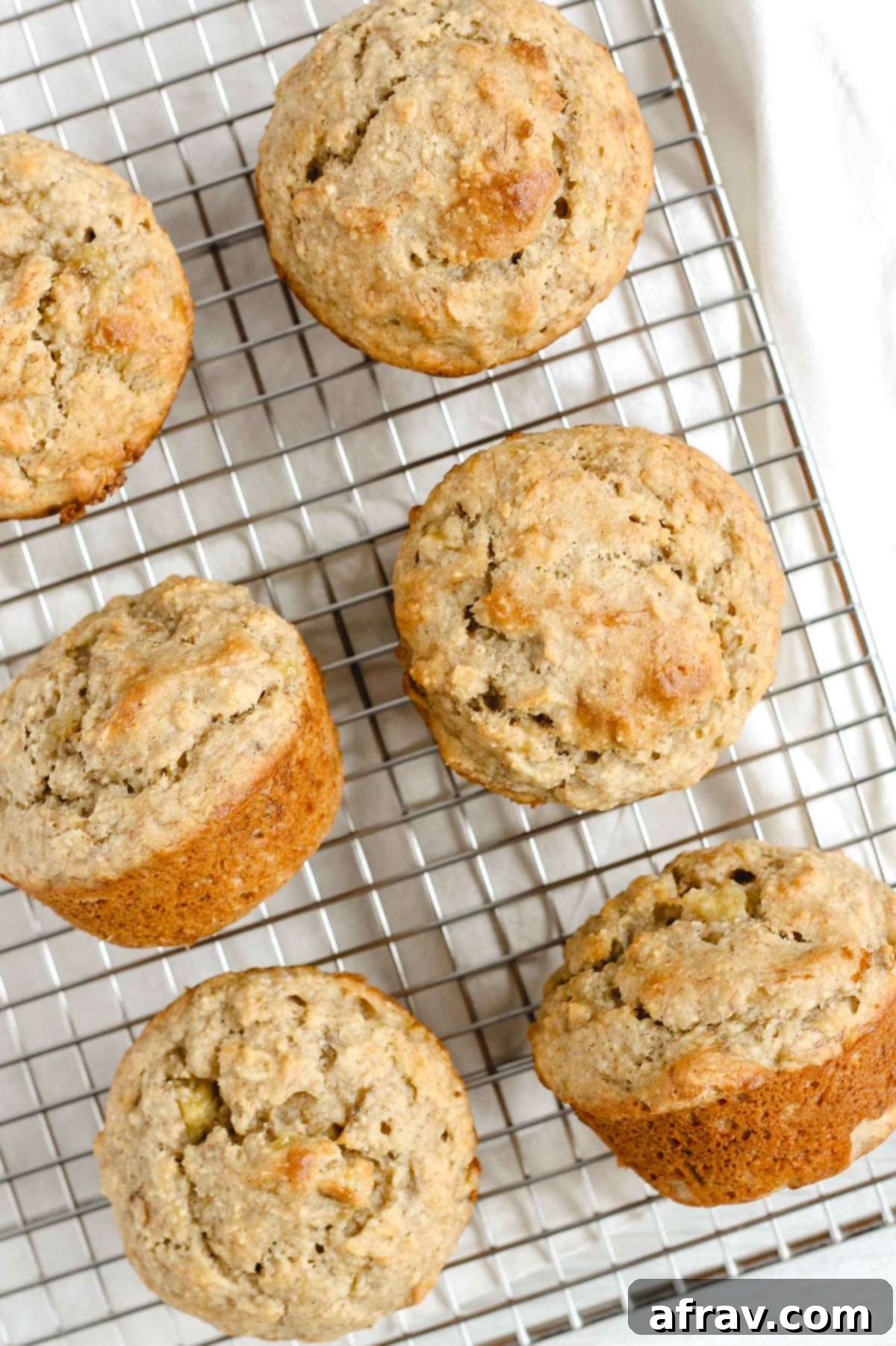 Gluten Free Banana Dream Muffins 10 A batch of freshly baked gluten-free banana muffins cooling on a wire rack, ready to be enjoyed.