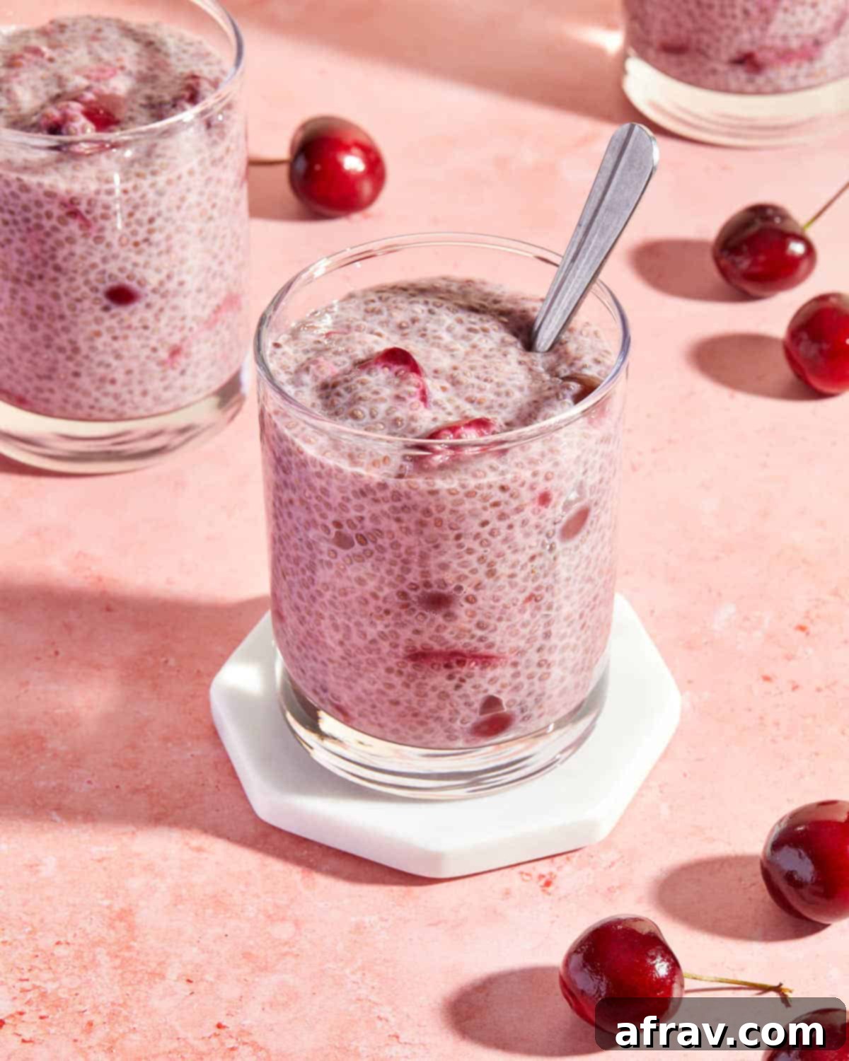 Delicious Dairy Free Gluten Free Cherry Chia Pudding 5 Chia pudding with fresh cherries served in glasses.