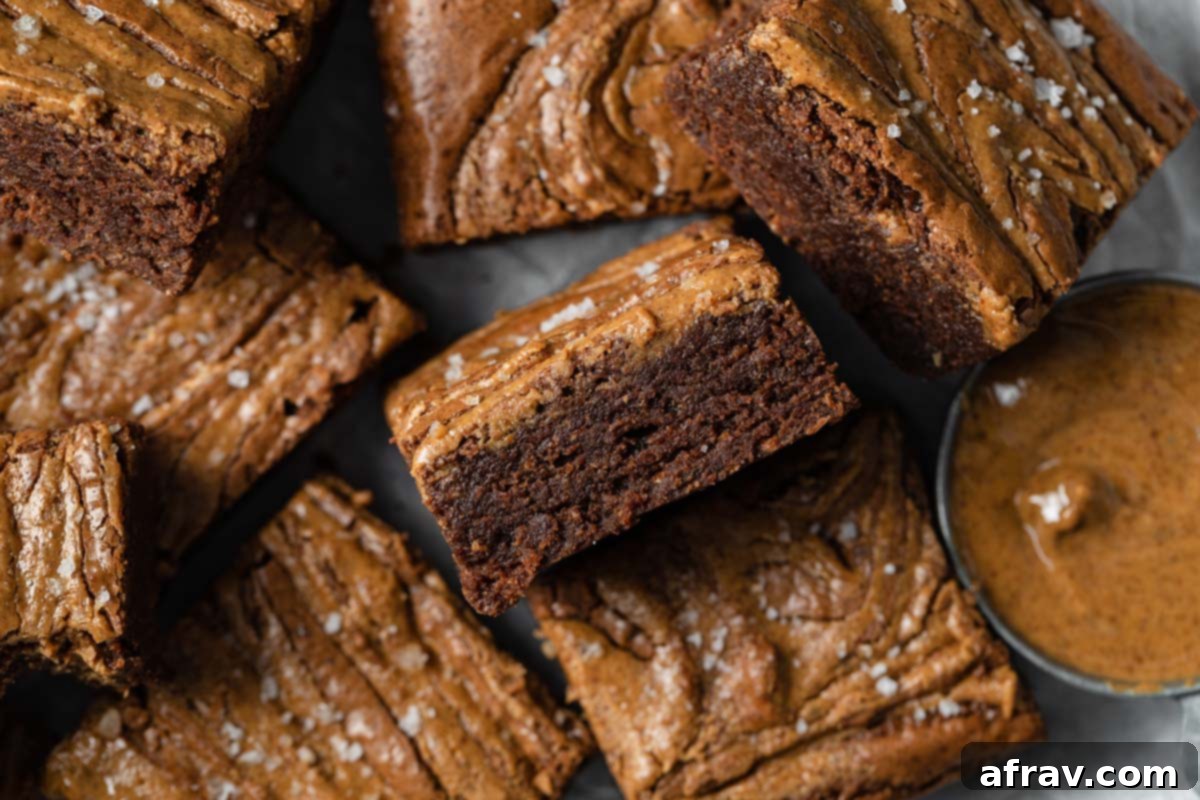 Decadent Dairy-Free Almond Butter Brownies 10 Overhead view of almond butter brownies arranged closely together.
