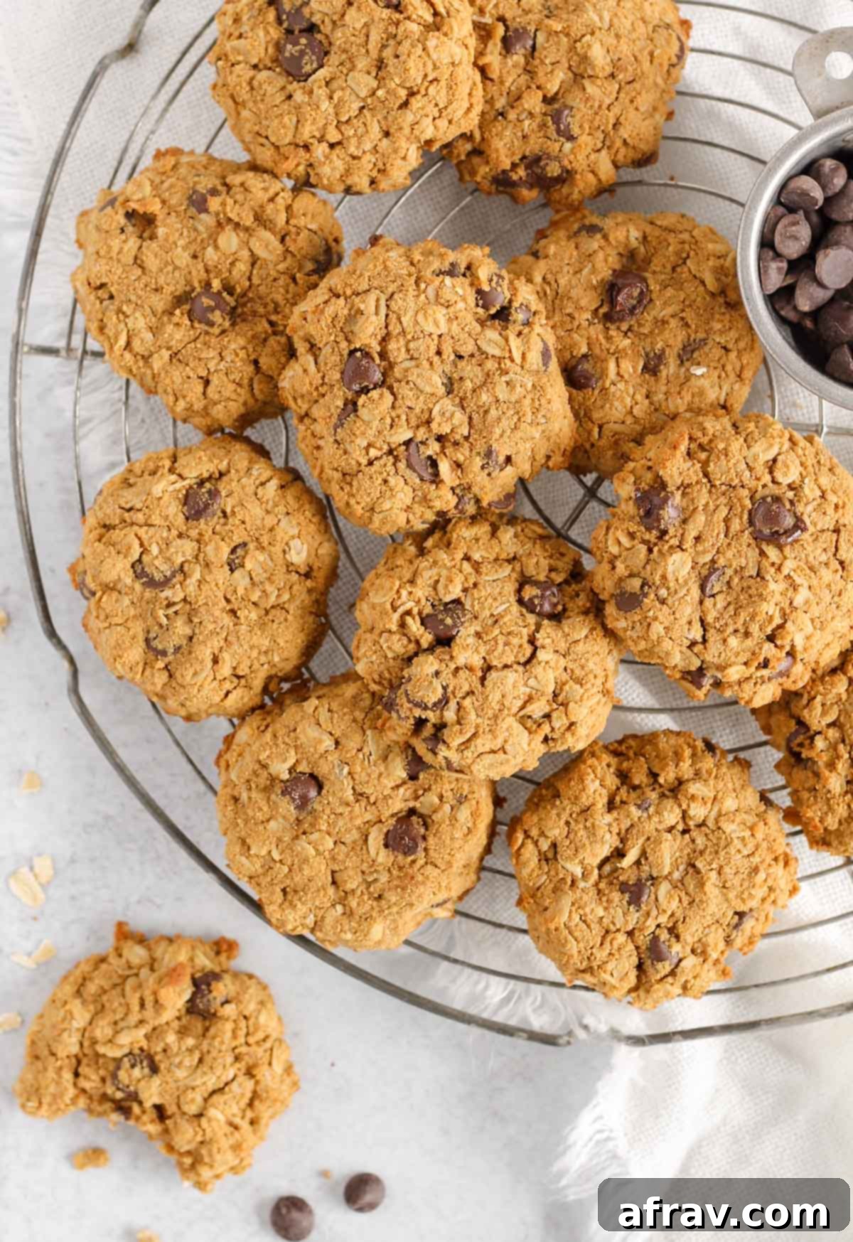 Effortless Coconut Flour Oatmeal Delights 7 Oatmeal cookies with coconut flour cooling on a round wire rack, indicating readiness to enjoy.