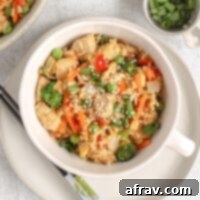 Chicken fried rice with lots of veggies in a single serve dish.