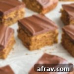 Banana snack cake topped with chocolate and cut into squares.