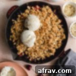 Cherry Almond Crisp baked up in a cast iron skillet.