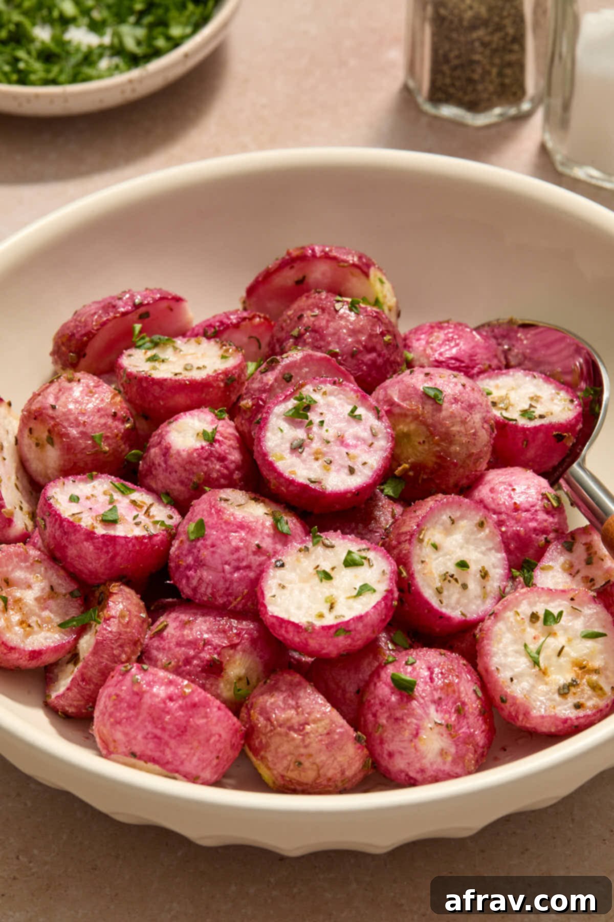 Close up side view of radishes served in a bowl.